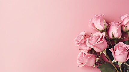 A bouquet of pink roses on a pink background copy space