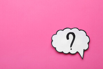 Paper speech bubble with question mark on pink background, top view. Space for text