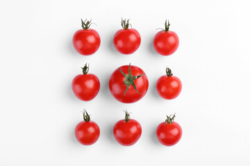Many ripe tomatoes on white background, flat lay