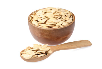 Wooden bowl and spoon with pumpkin seeds isolated on white
