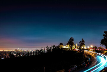 Light Trails on the Road to Griffith Observatory with a View to Los Angeles Skyline - California, USA