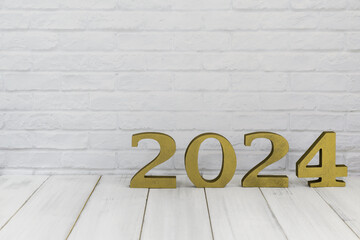 2024 new year on white wood table over white background with copy space