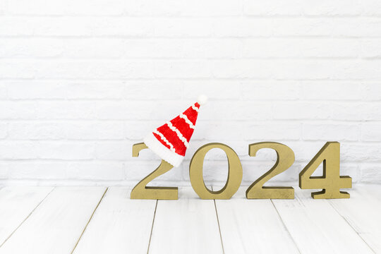 2024 new year and christmas hat on white wood table over white background  with copy space