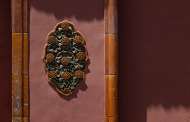 Decoration on red wall in Forbidden City, Beijing, China