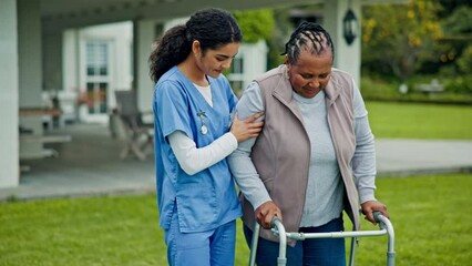 Senior care, old woman with walker and caregiver in garden with support, help or trust at nursing home. Physical therapy, retirement progress and elderly person with nurse walking on grass together.