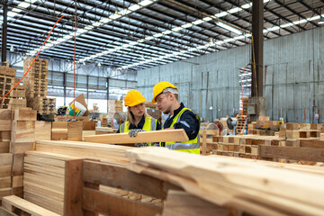Naklejka na ściany i meble Dedicated Team Analyzing Lumber Quality in Warehouse