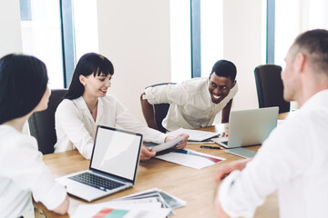 Office coworkers smiling during meeting