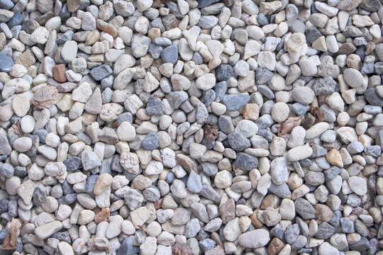 Many small rocks background seamless patters top view close up