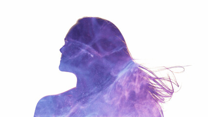 Female silhouette. Ethereal energy. Esoteric enlightenment. Double exposure neon glow purple blue mist in woman profile isolated on white background copy space.