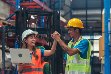 Warehouse management team using computer laptop check stock inventory. Asian men women worker use software computer type keyboard goods shelf. Teamwork logistics staff counting stock store inventory