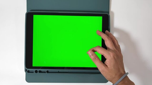 woman holding green screen ipad
