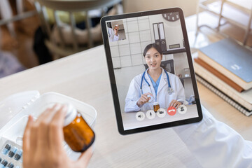 Doctor meeting online and discussing about new drug by video call on tablet