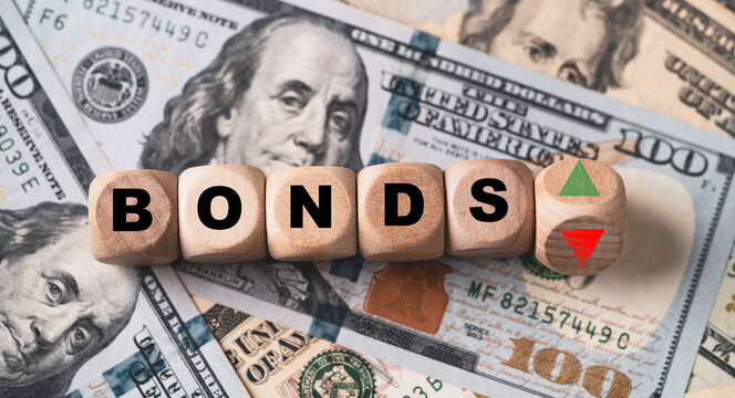 Bonds wording with up and down on USD dollar banknote for Bonds yield return of United States of America interest increasing and decreasing concept.