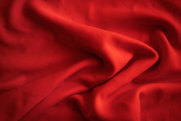 Red wavy cloth. Red fabric background.