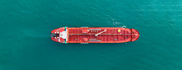 Aerial angle side view of oil delivery ships in the high sea. oil tanker container ship to port,...
