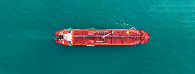 Aerial angle side view of oil delivery ships in the high sea. oil tanker container ship to port,...