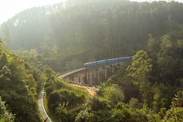 Train crosses Demodara nine arch bridge. Sri Lanka