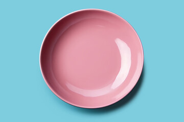 Empty pink plate on blue background, intermittent fasting concept.
