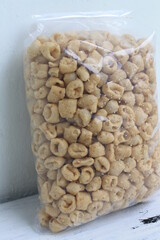 Indonesian snack called pothel in plastic on a table packaging, table, plastic, market, food, delic