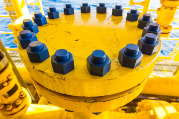 Oversized flange, large tube painted yellow with lots of bolts and nuts painted blue.