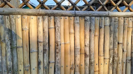Foto op Plexiglas brown bamboo fence texture background © ADP