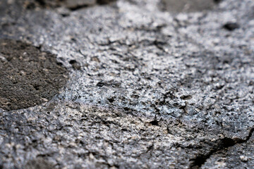 Closeup detail of black volcanic rock texture