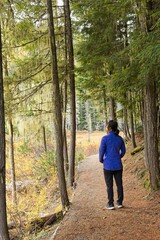 Woman enjoys a hike through nature.