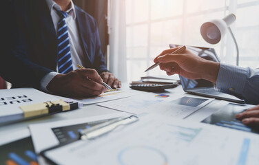 Asian business advisory meeting To analyze and plan the situation in financial reports. Company budget in the conference room investment consultant financial advisor and accounting concepts.