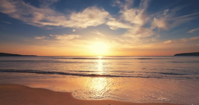 Beautiful sea sunrise over splashing waves on the beach sand, inspirational morning and exotic shore