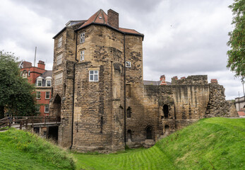 a view of the moat and gate tower of Newcastle Castle, Newcastle-upon-Tyne, UK