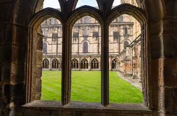 Fototapeta na wymiar looking through windows at the cloisters at Durham Cathedral, Durham, UK