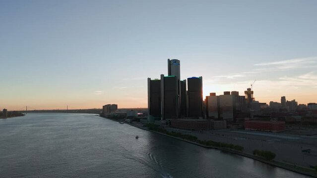 Drone wide shot of the city of Detroit. Central Business District and Detroit river at Evening . 