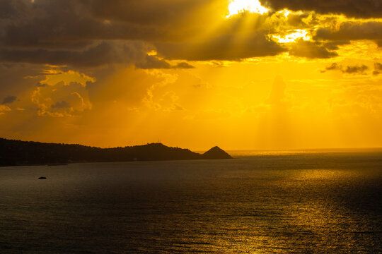 Atmospheric sunset on the Tyrrhenian coast in the bay of Gioiosa Marea (province of Messina) Sicily, Italy.