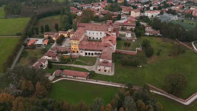 Tilting movement Abbazia Morimondo top shot in the countryside of Lombardia close to Abbiategrasso