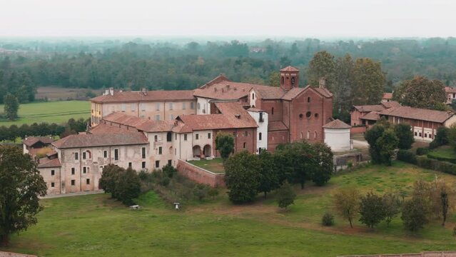 orbiting right close up movement Abbazia Morimondo top shot in the countryside of Lombardia close to Abbiategrasso