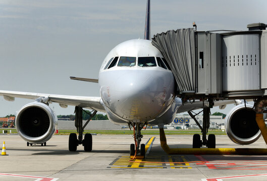 Geneva, Switzerland, Europe - airliner connected to passenger bridge, Cointrin Geneva Airport