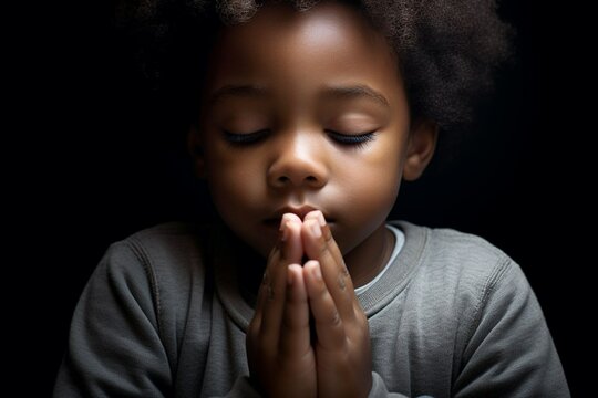 Christian child religion concept in his prayer time
