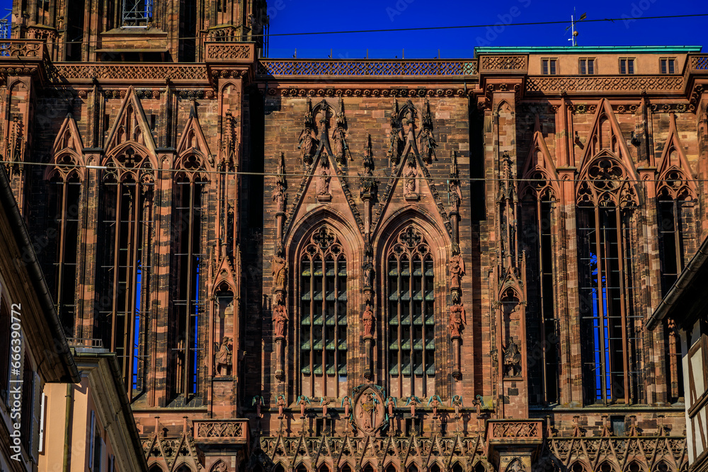 Wall mural Ornate Gothic facade and the intricate windows of the Notre Dame Cathedral in Strasbourg, France one of the most beautiful Gothic cathedrals in Europe