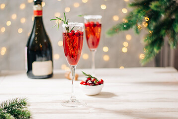 Cranberry red mimosa celebration beverage with sparkling wine Christmas or New year celebration drink