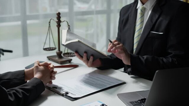 Lawyer or legal advisor finalizes the contract. Business legal agreements, constraints, consulting between lawyers and business clients, tax and legal firms. the concept of righteousness and justice