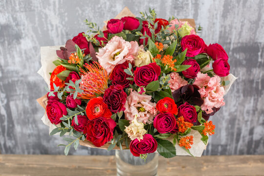 Small Beautiful bouquet of mixed flowers in vase. Floral shop concept . Beautiful fresh cut bouquet. Flowers delivery