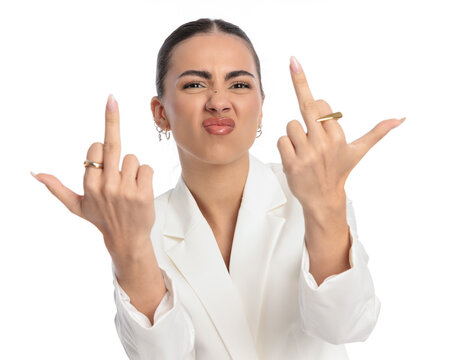 vulgar elegant woman making a face and showing middle fingers