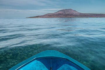 boat sailing towards the CORONADO Island with transparent blue sea and clear blue sky on sight,...