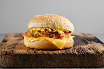 Little cheeseburger junior with breaded patty, front view