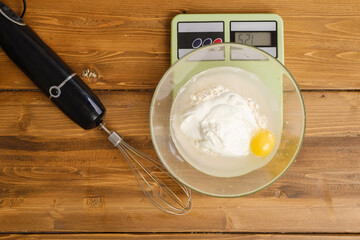 Weighing pancake ingredients in a bowl