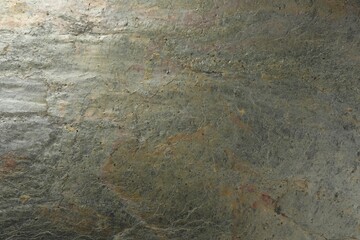 Texture of grey stone surface as background, closeup