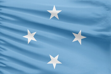 Micronesia flag background is depicted on a sport stitch cloth fabric with folds.