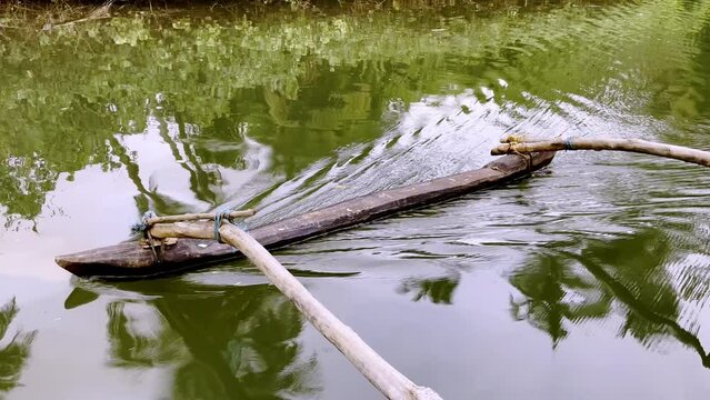 Closeup shot of oars of traditional fishing boat at Saleri river Goa India 4K