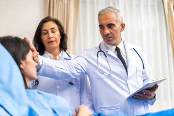 Senior man doctor wearing uniform with stethoscope help discussing and consulting talk to sick woman patient checkup information, support, care, diseases, treatment in hospital.healthcare