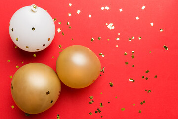 Background with fastive air balloons of round shape and confetti, multicoloured top view. Birthday...